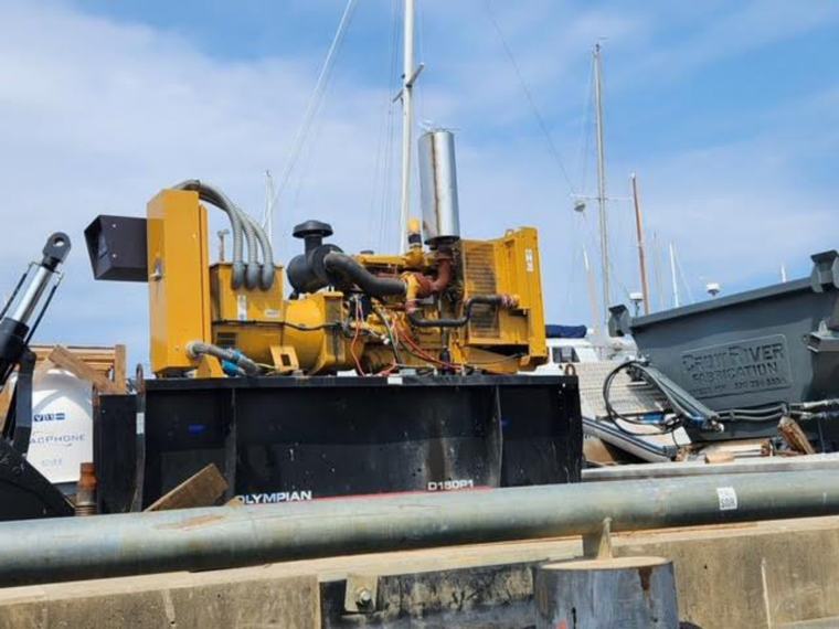 Excavator mounted on the vessel deck