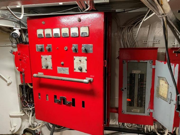 Red electrical switchboard panel in the engine room