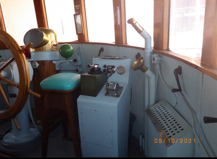 Traditional wooden ship wheel in the Stryker wheelhouse